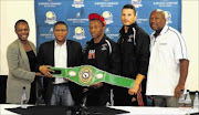 ALL GROWN UP: From left to right: Boxing SA's acting chairperson Ntambi Ravele, Sport Minister Fikile Mbalula, newly-crowned NABF cruiserweight champion Thabiso Mchunu, trainer Sean Smith and BSA's acting chief executive Loyiso Mtya
PHOTO: Ryan Toerien