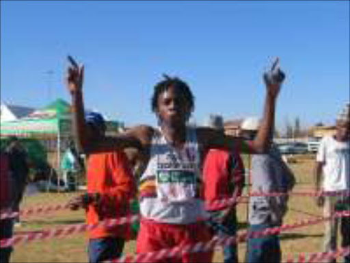 FINISHING LINE: Most of the participants at the World Athletics Day celebrations hope to finish like this runner. Pic. Mbuzeni Zulu. 24/07/05. Sowetan.