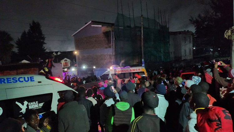 Resident mill around the building as rescuers evacuate trapped families from the collapsed building in Nairobi’s Mountain View Ward along Naivasha Road, May 7, 2024.