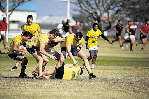 GETTING DOWN TO IT: Wits University in action during their training at Grens yesterday ahead of their clash against Varsity College today Picture: MARK ANDREWS