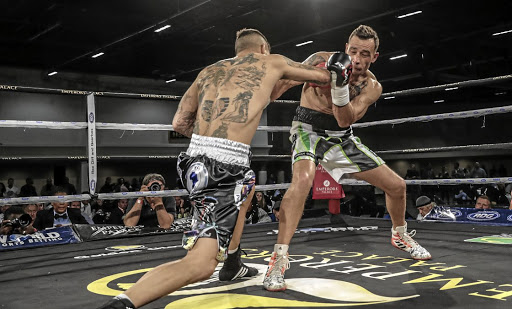 Wade Groth, left, pulverises Wynand Mulder on his way to the interim SA middleweight title on Friday night.