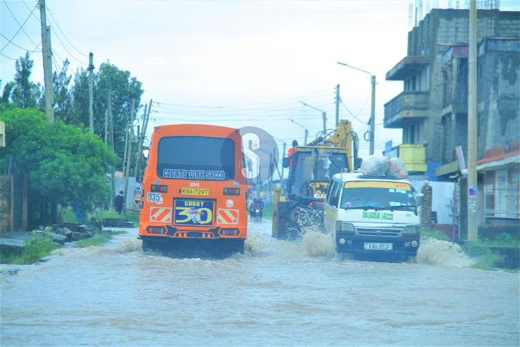 Vehicles along the flooded Syokimau-Katani road in Machakos County on Sunday, April 21, 2024.