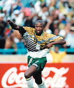Phil Masinga celebrates scoring South Africa’s only goal in the game against Congo, which booked the country a place in the 1998 Soccer World Cup in France.
