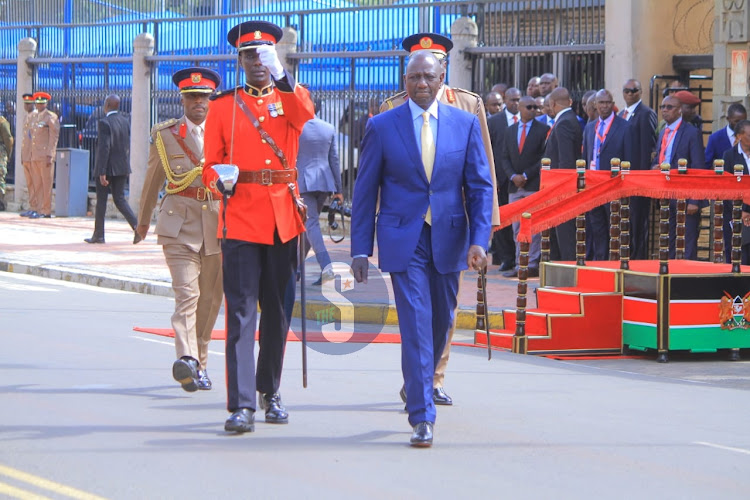 President William Ruto ready to inspect a guard of honour outside Parliament buildings on November 9, 2023