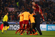 Roma's Aleksandar Kolarov and team mates celebrate at the end of the match. 