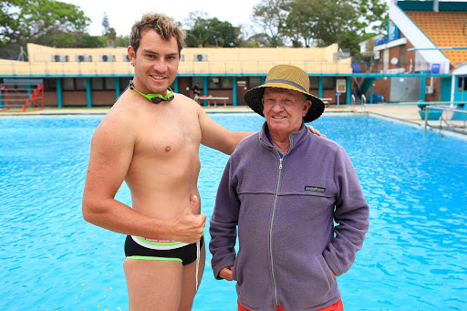 HERO: Michael Swartz, left, with his swimming coach Joe Hillstrom. Michael saved a child and two adults from drowning on Friday Picture: STEPHANIE LLOYD