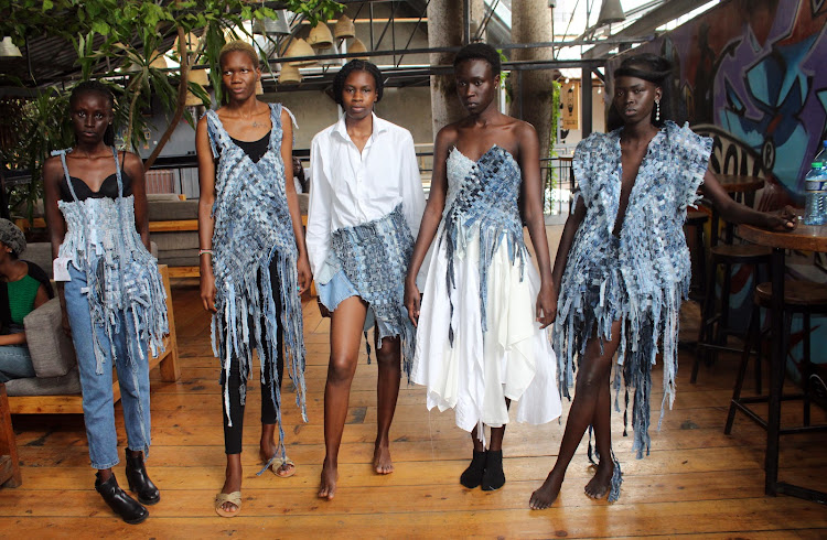Models dressed in of the designer clothes made from mitumba at Westlands, Nairobi on March 31.