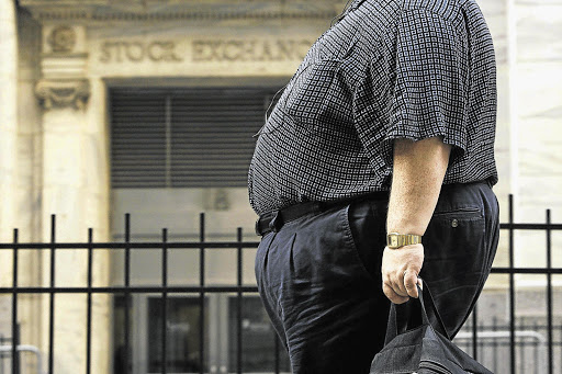 An overweight man. Men are as likely to be measured overweight or measured clinically obese as women, says Weight Watchers.