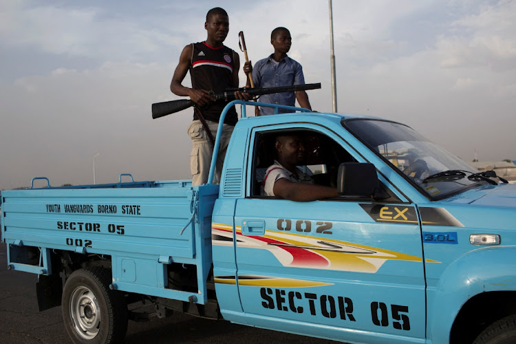 Members of civilian joint task force patrol in Maiduguri. Picture: JOE PENNEY/REUTERS