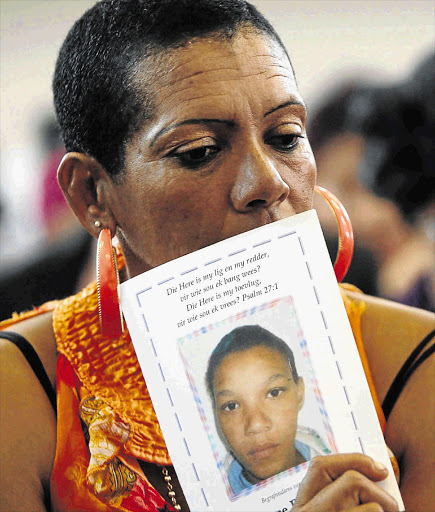 LIFE CUT SHORT: Anene Booysens's foster mother, Corlia Olivier, during the teen's funeral service