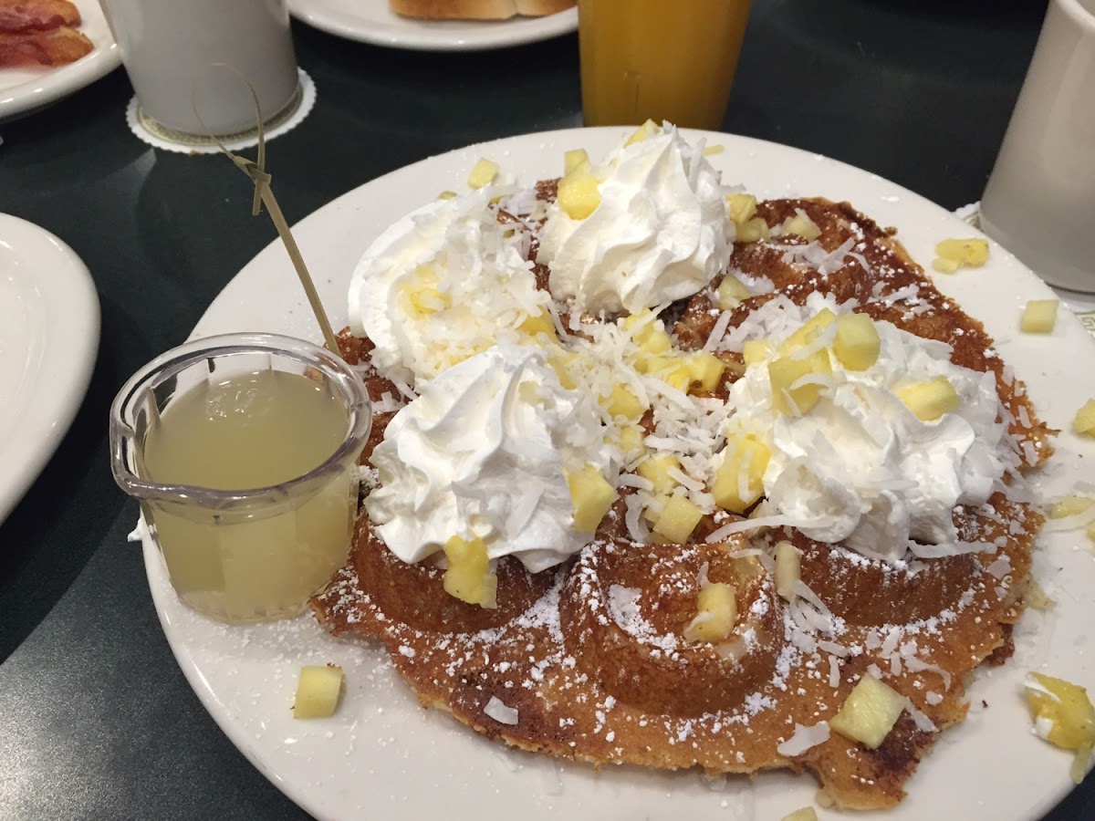 GF Hawaiian waffle with tons of pineapple and coconut and coconut syrup. Please note the little stic