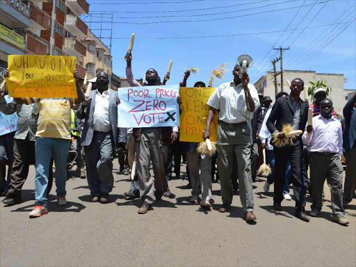 Farmers protest in Eldoret town against poor maize and wheat prices on Monday /JESSICCA NYABOKE