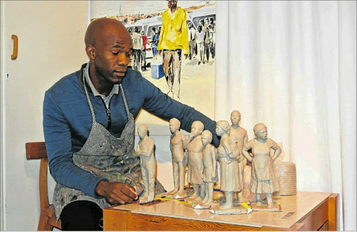 EVERYDAY INSPIRATION: Fine artist Mziwoxolo Makalima works on some of his sculptures Picture: SUPPLIED