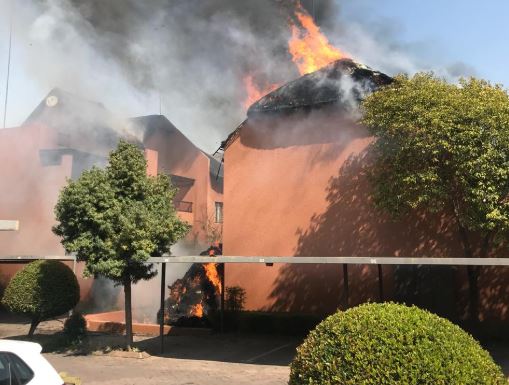 A fire rages at the Serengeti Sands townhouse complex in Sunninghill, Johannesburg on August 23.