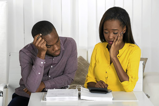 As a couple, you can't put your own financial health and monthly budget at risk by spending money you can't afford on family demands. / 123RF