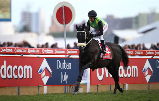 Winner THE CONGLOMERATE (AUS) (Jockey) Piere Strydom (Trainer) Joey Ramsden during the 2016 Vodacom Durban July at Greyville Racecourse on July 02, 2016 in Durban, South Africa
