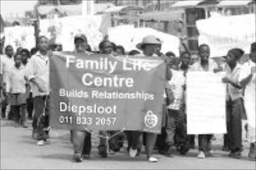 ENOUGH: Pupils marched to the offices of the Justice Department yesterday to deliver a memorandum against gendet violence. Pic. Mohau Mofokeng. 29/11/06. © Sowetan.