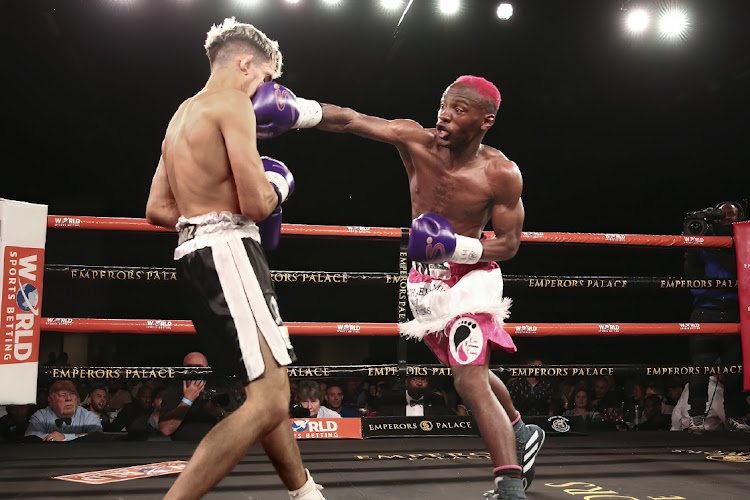 Ricardo 'The Magic Man’ Malajika puts straight in the face of Kevin Luis Munoz of Argentina en route to winning the IBO junior bantamweight title at Emperors Palace.