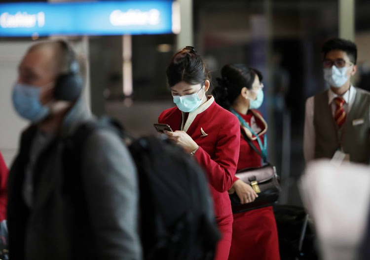 Passengers arrive at Cape Town International Airport from Hong Kong on January 29 2020 after being screened by health officials due to the outbreak of coronavirus in China.