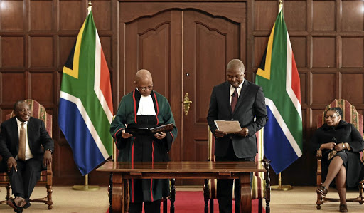 David Mabuza is sworn in by chief justice Mogoeng Mogoeng this week as President Cyril Ramaphosa and speaker of the National Assembly Thandi Modise look on.