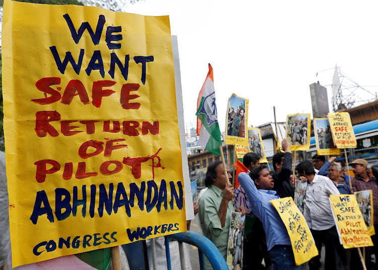 Demonstrators hold placards and shout slogans during a protest demanding the release of an Indian Air Force pilot after he was captured by Pakistan in Kolkata, India, on February 28 2019.