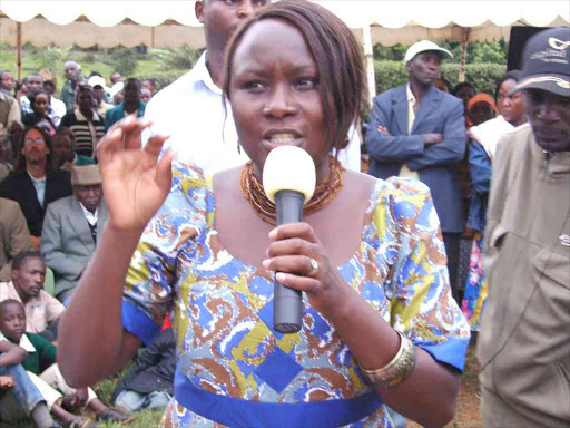 Runyenjes MP Cecil Mbarire speaks to keen residents at her constituency Photo/Reuben Githinji