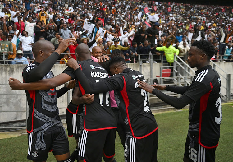 Orlando Pirates players celebrate Tapelo Xoki's goal during the Nedbank Cup semifinal against Chippa United at Nelson Mandela Bay Stadium.