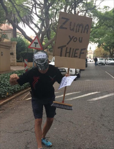 Protestor outside the Gupta residence in Saxonwold