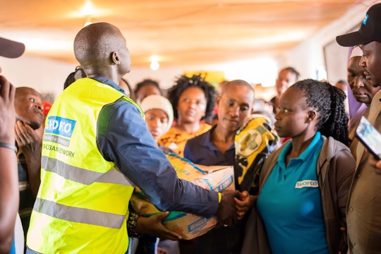 Shining Hope for Communities (SHOFCO) staff distributing foodstuffs to flood victims in Matahre on Thursday, April 25, 2024.