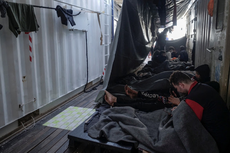Migrants wait to disembark on board the 'Ocean Viking', in the Mediterranean Sea, November 10 2022. Picture: CAMILLE MARTIN JUAN/SOS MEDITERRANEE/REUTERS