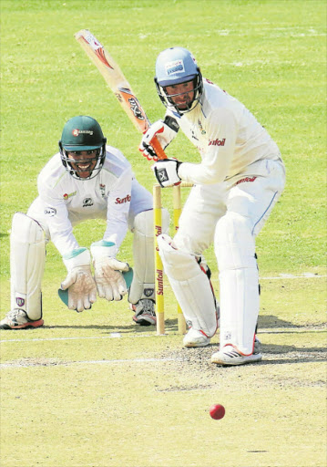 Picture: MICHAEL PINYANA READY TO STRIKE: Clyde Fortuin of the Warriors keeping an eye on the ball as Hein Klaasen of the Titans aims for a shot during their Sunfoil 4-day game at Buffalo Park in East London yesterday Picture: MICHAEL PINYANA