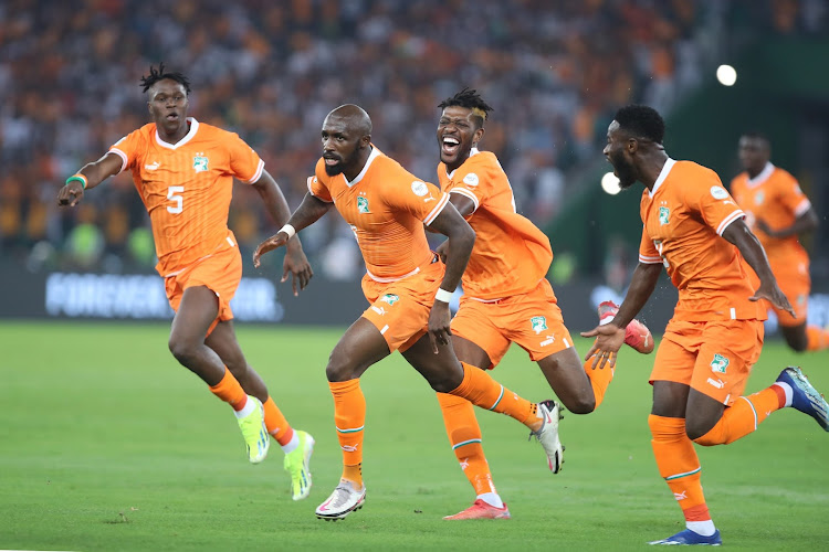 Seko Mohamed Fofana of Ivory Coast celebrates goal with teammates during the 2023 Africa Cup of Nations opening match against Guinea-Bissau at Alassane Ouattara Stadium in Abidjan, Ivory Coast.