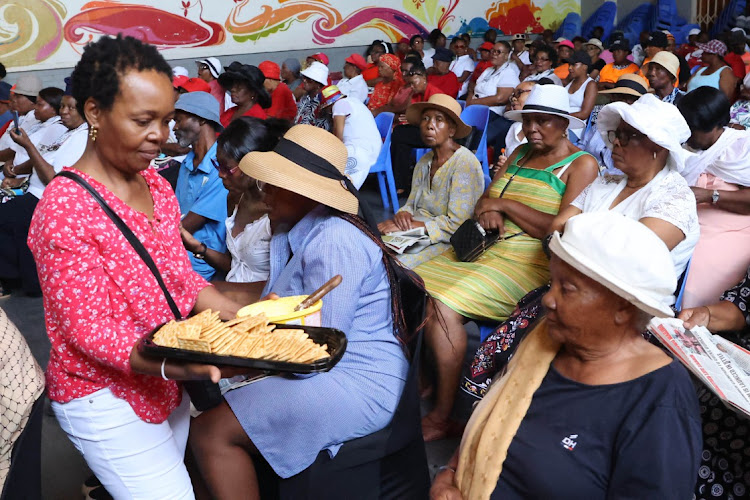 Dipuo Difedile members get some goodies during a meeting in their Soweto venue.