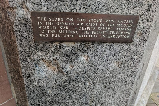 THE SCARS ON THIS STONE WERE CAUSED IN THE GERMAN AIR RAIDS OF THE SECOND WORLD WAR. DESPITE SEVERE DAMAGE TO THE BUILDING. THE BELFAST TELEGRAPH WAS PUBLISHED WITHOUT INTERRUPTION Submitted by @jucopel