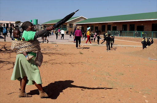 August 2016. Angry parents yesterday forcefully removed teachers who were allegedly against the installation of closed circuit TV cameras at Ntji Mothapo Primary School in GaMothapo village, Limpopo. Pic: Sandile Ndlovu. © Sowetan