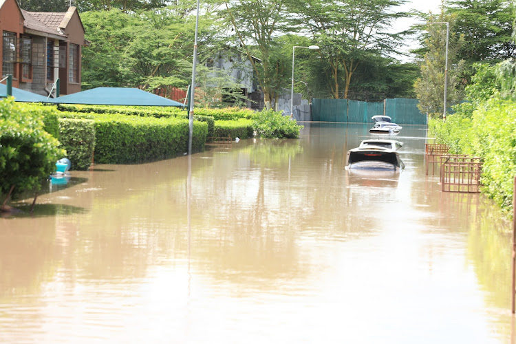 Vehicles marooned in an estate in Athi River, Machakos on April 24, 2024.