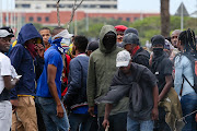 Protesting students blocked roads leading to Nelson Mandela University on Monday, disrupting registration.