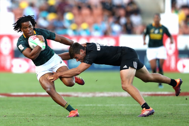 Stedman Gans of South Africa makes a break against New Zealand during day two of the 2019 Hamilton Sevens at FMG Stadium on January 27, 2019 in Hamilton, New Zealand.