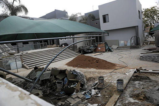 Building material on the property where Pastor Alph Luhau plans to build a guesthouse.