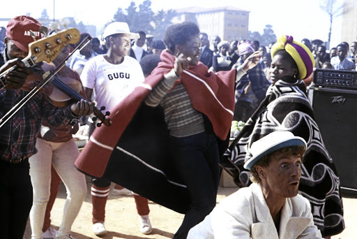A still from McLaren's music video for 'Soweto', shot in and around Joburg and Soweto. After 40 years, it's hard to identify the musicians in the pic but experts agree that the fiddle player is Noise Khanyile, and the bass and guitar players probably from the Noise Khanyile Band.