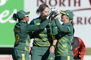 Trisha Chetty, Dane van Niekerk and Mignon du Preez of South Africa celebrate the wicket of Sanjida Islam of Bangladesh during 1st Womens ODI match between South Africa and Bangladesh at Senwes Park on May 04, 2018 in Potchefstroom, South Africa. 