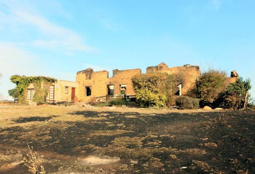 A building destroyed by wildfires is seen near Plettenberg Bay. Strong winds fanned fires destroyed houses and prompted the evacuation of thousands of residents in nearby Knysna. Picture taken June 8, 2017.