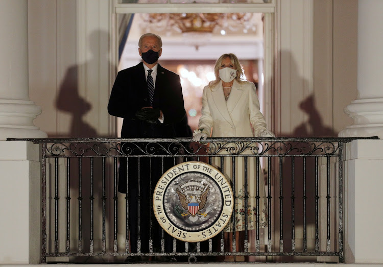 US President Joe Biden and first lady Jill Biden watch fireworks from the balcony of the White House after his inauguration as the 46th President of the United States, US, on January 20, 2021.
