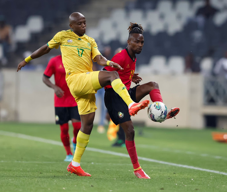 Bafana Bafana striker Zakhele Lepasa and Domingos Macandza of Mozambique during the international friendly at Mbombela Stadium on November 17 2022.