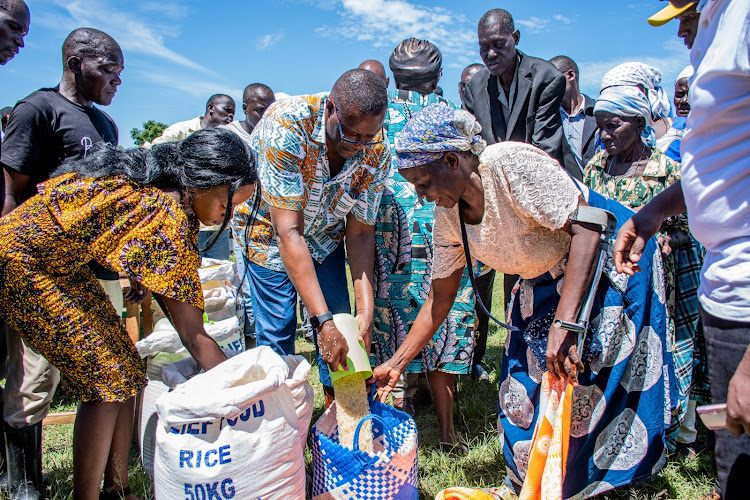 Information and Communication Technology (ICT) Cabinet Secretary Eliud Owalo during distribution of food to displaced families in Nyakach and Nyando sub counties on Monday.