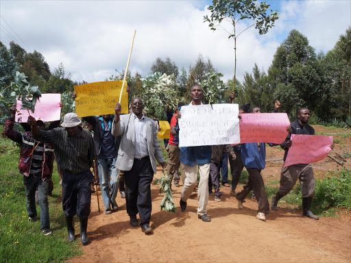 Some residents of Ndiuni in Ndeiya Ward hold a peaceful protest at the land which is alleged to have been grabbed in the area.