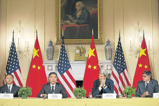 HEAVYWEIGHT GATHERING: From left, State Councillor of China Yang Jiechi, Vice-Premier of China Wang Yang, US Secretary of State John Kerry and US Treasury Secretary Jack Lew at the closing session of the US-China Strategic and Economic Dialogue held at the State Department in Washington DC this week. The annual event is a bilateral forum for the two superpowers where China and the US discuss a broad range of issues, especially in the area of trade and the global economy Picture: EPA