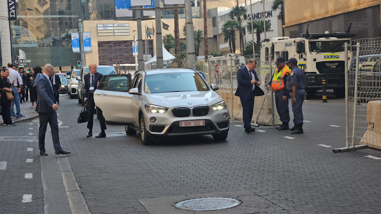 Luxury cars and security personnel were thick on the ground in Sandton, Africa's most affluent square mile.