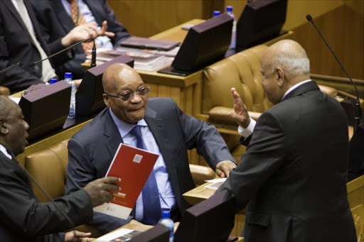 Minister of Finance Pravin Gordhan speaks to Deputy President Cyril Ramaphosa and President Jacob Zuma ahead of his 2016 Budget Vote Speech in the National Assembly. Picture Credit: Gallo Images