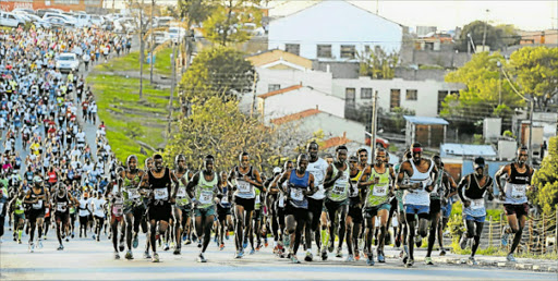 PUSHING FOR ALL THEIR WORTH: The 10th Mdantsane 10km road race took place last year. Runners started at the Sisa Dukashe Stadium and made their way through the streets of Mdantsane. Picture: ALAN EASON